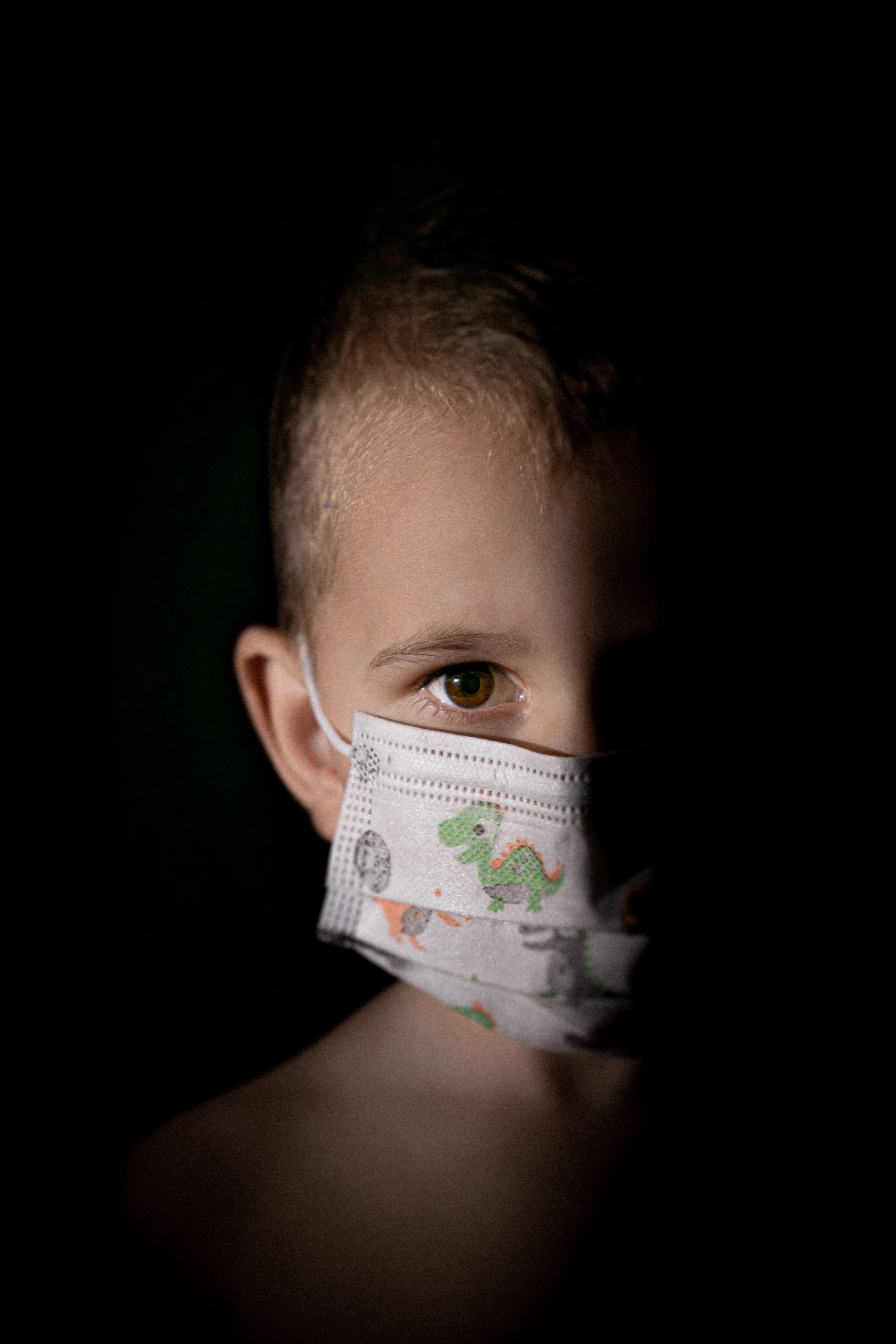 child wearing a covid-19 mask for protection